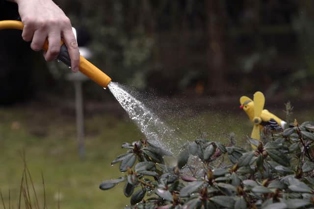File photo of a person using a hosepipe (Photo Illustration by Christopher Furlong/Getty Images)