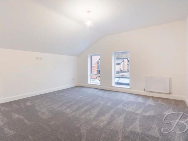 Another bedroom, well presented and an excellent size. High ceilings and ample natural light are the order of the day.