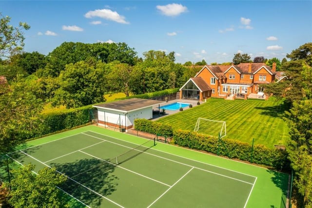 The heated outdoor pool has varying depths, a retractable cover and a salt water chlorinator. The full sized tennis court has a repainted multi-surface and is enclosed by high chain-link fencing