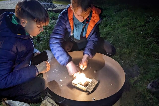 Two Scouts having a go at fire lighting