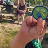A Squirrel Scout holds a badge
