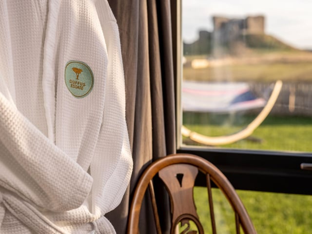 The cabin comes complete with fluffy bathrobes.