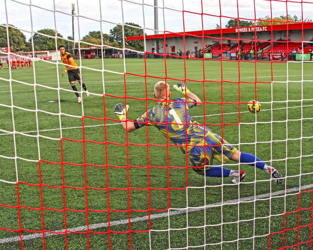 Louis Walsh scores the winning penalty in Sunday's FA Trophy shoot-out win for Bedford Town. Photo by Adrian Brown.