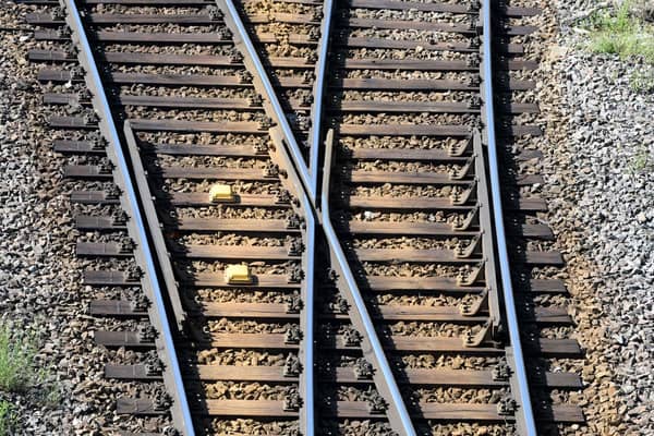 Rails and a track switch  (Photo by THOMAS KIENZLE/AFP via Getty Images)