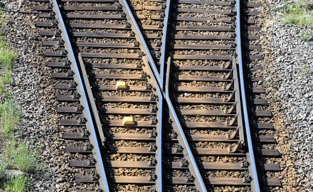 Rails and a track switch  (Photo by THOMAS KIENZLE/AFP via Getty Images)