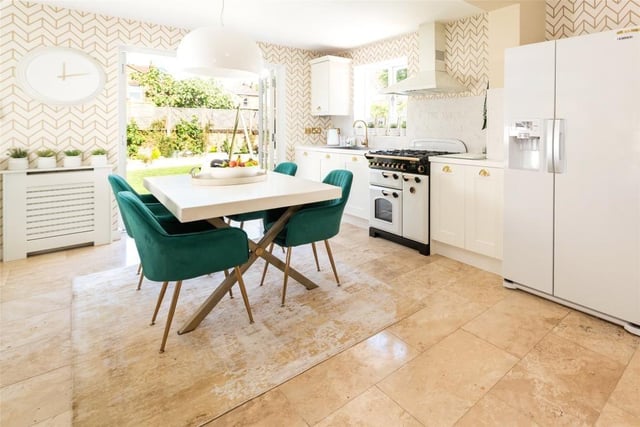 The open plan kitchen/breakfast room is fitted in a custom-built range of Shaker style cabinets. Other appliances included in the sale are a Rangemaster oven, an American fridge/freezer, a dishwasher and washing machine. There is also electric underfloor heating