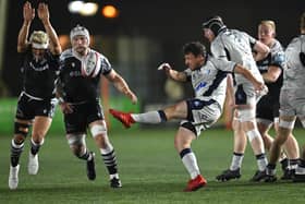 Blues scrum half James Lennon kicks upfield during the Premiership Rugby Cup match at Newcastle Falcons. Photo: Getty Images.