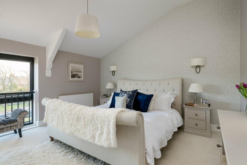 This room measures 13ft 6in by 12ft 11in and boasts a walk-in wardrobe and en suite