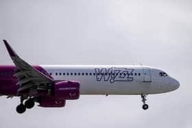 A Wizz Air jet comes in to land (Photo by BEN STANSALL/AFP via Getty Images)