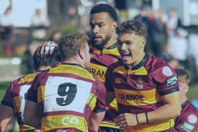 Joy: Ampthill celebrate scoring against Caldy