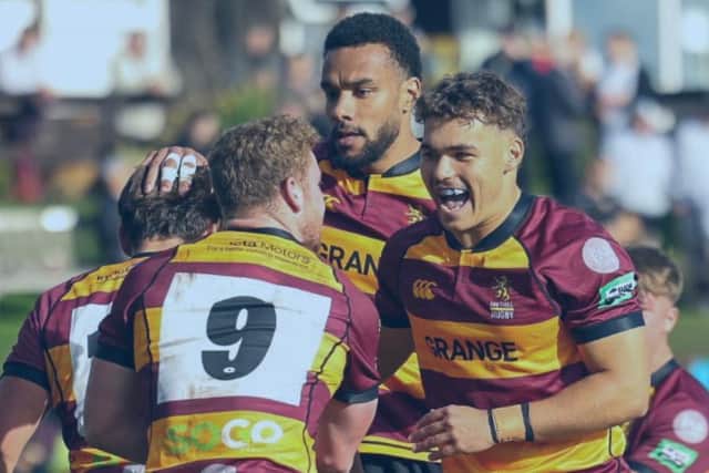 Joy: Ampthill celebrate scoring against Caldy