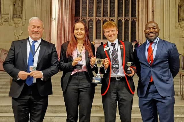 Schools debate competition winners with MP Richard Fuller (left) and PCC Festus Akinbusoye (right)