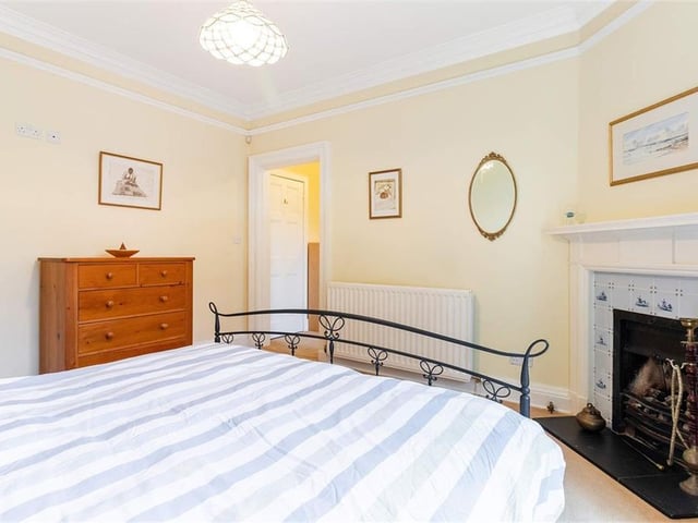 The master bedroom includes a feature fireplace.