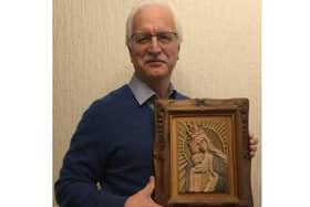 Author Bryan Wiles, with the copy that he carved of the Tadeusz Zielinski icon, the Mother of God Victorious.