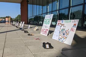 Protestors lined up pairs of shoes to represent each child without a SEND place