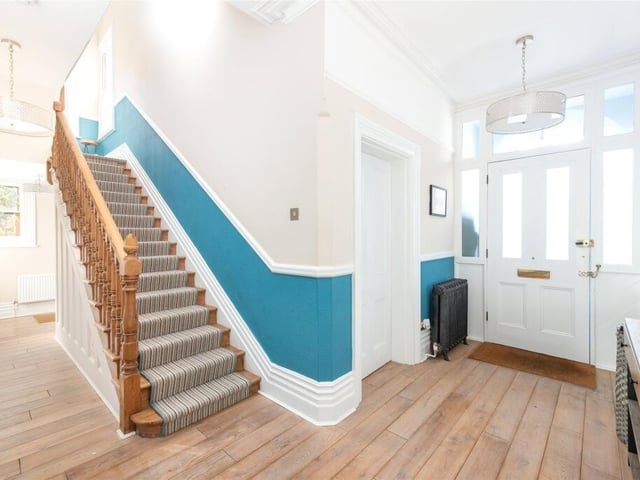 The reception hall has exposed oak flooring which continues throughout the ground floor, and traditional features including moulded cornicing and picture and dado rails