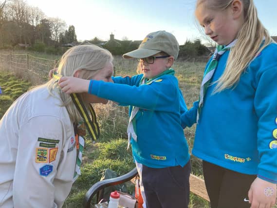 Autumn, Megan and William present Nicky with her Silver Acorn