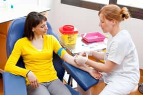 A phlebotomist at work