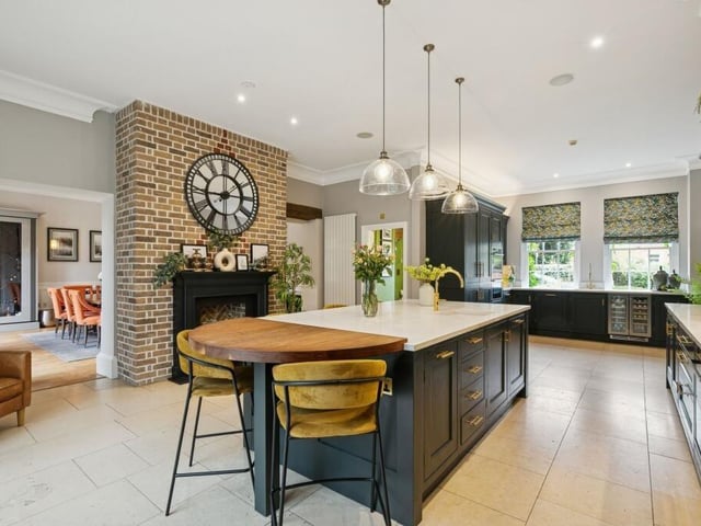 A substantial central island provides seating for five, the kitchen features Neff and Miele appliances, including three ovens, steamer, microwave, two dishwashers and wine fridge, together with a boiling water tap