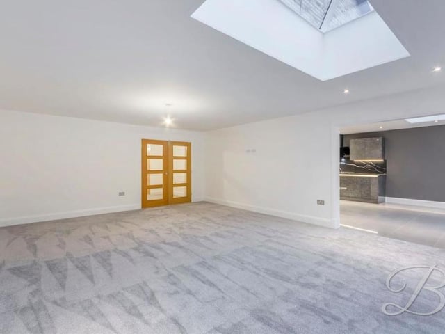The lounge from another angle. Note the beautiful floor finish and also the fact that the whole property boasts a full security alarm system. It is BT fibre enabled, with Cat6 cables to each TV point.