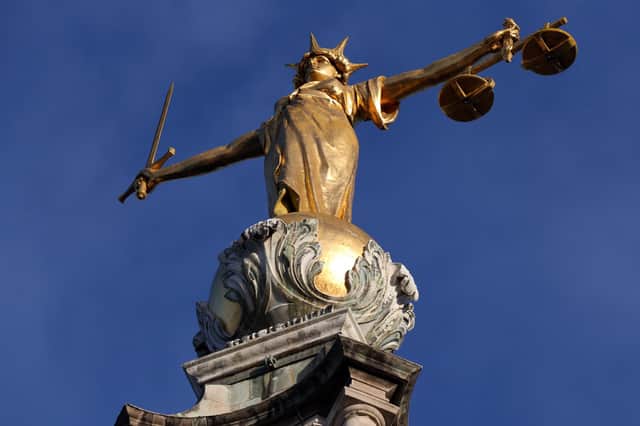 Statue of Justice above the Central Criminal Court building, Old Bailey in London.