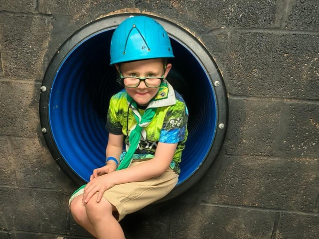 A Beaver Scout ready to go caving