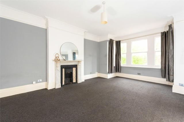 This room has a bay window with views of the riverside Embankment. There are deep skirtings, a central ceiling rose and a marble fireplace with an open grate
