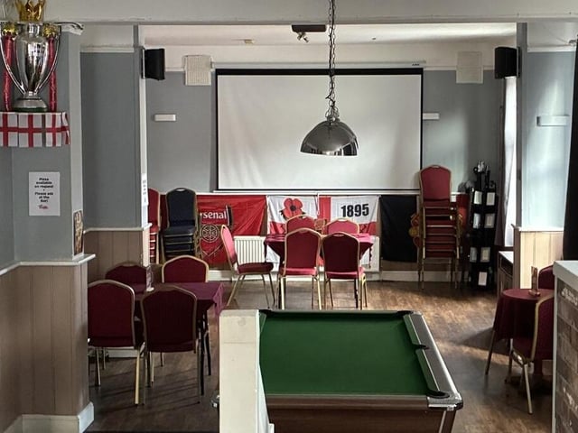 The games area features a pool table, large projector and additional seating
