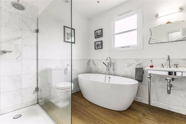 The family bathroom on the first floor has been sympathetically updated to provide a freestanding bath, separate shower cubicle, basin and WC. There is also a period style radiator/heated towel rail and half marble tiled walls