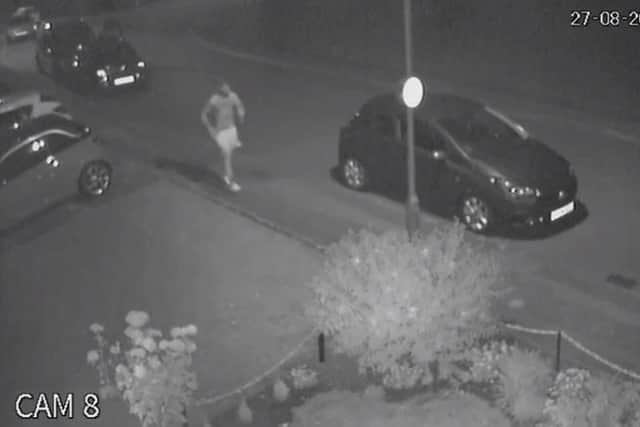 Still from CCTV released by Bedfordshire Police of a man they believe could have information about a Bedford hit and run