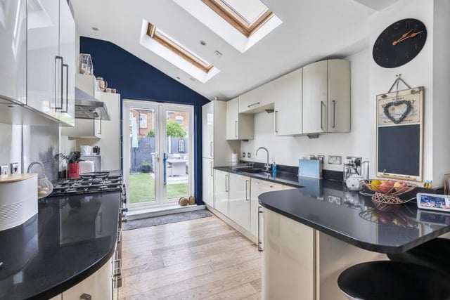 The kitchen and breakfast room have been combined to provide a family space with French doors opening to the rear garden