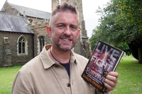 Shaun Pinner with his book: Live Fight Survive. Picture: Tony Margiocchi