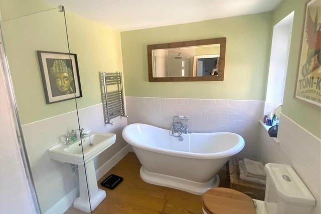 The four-piece refitted bathroom suite with roll top bath and large walk-in shower. There is also en suite shower room to the master bedroom on the top floor