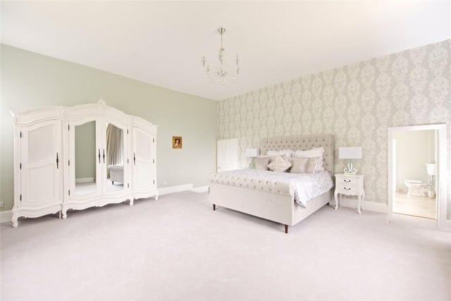 The principal bedroom is at the west end of the house and has dual aspect windows with views over the garden and the moat