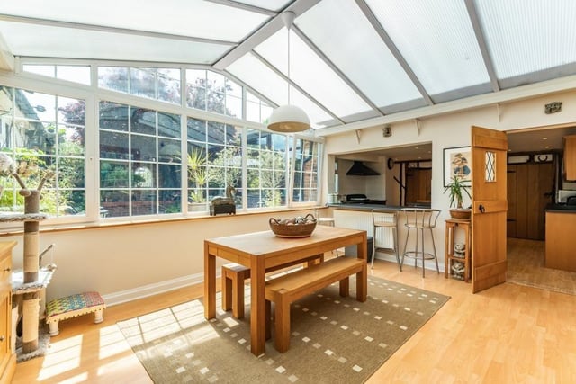 This conservatory - with a vaulted ceiling - is one of two in this property