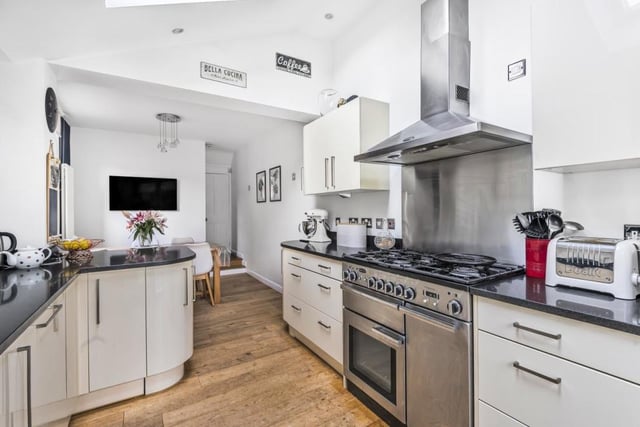 There is plenty of cupboard space with Quartz worktops and some built-in appliances as well as Velux roof windows for additional light. The room measures 24ft 4in by 8ft 10in