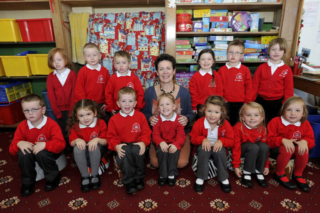 Lesley Hutchinson with her new reception pupils at Belford First School.