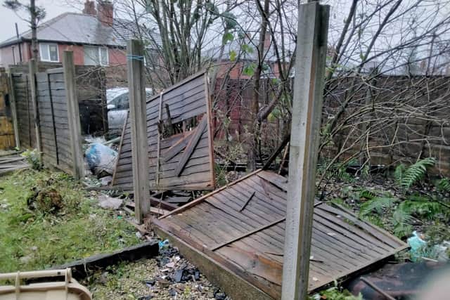 There was discarded wood, plastic, glass, and other materials from the property, as well as an overgrown front garden