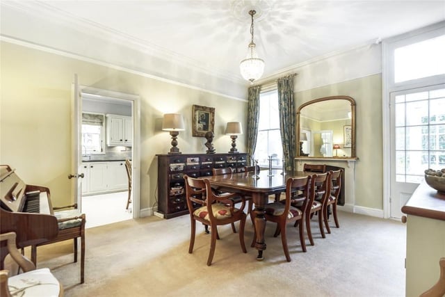 This room - which measures 16ft 3in by 11ft 11in - has a feature fireplace and sash window