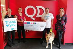 Cheryl and Charlotte of QD Bedford donating the funds to Nick and Portia of Sue Ryder