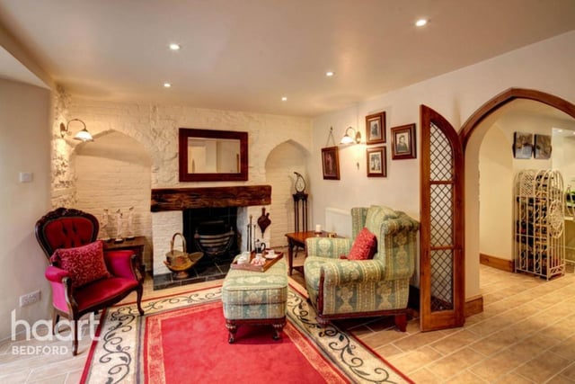 To the rear of the property is the spacious lounge and snug area with feature fireplace