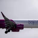 A Wizz Air jet comes in to land  (Photo by BEN STANSALL/AFP via Getty Images)