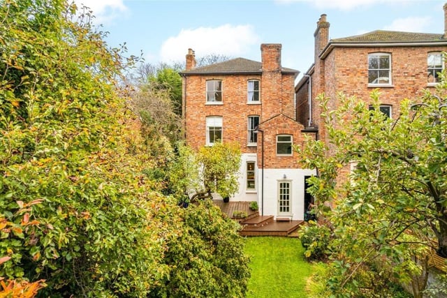 A passageway at the side leads to the west-facing rear garden which backs on to the grounds of Bedford School. It is a particular feature of the property and is walled all around providing screening and privacy. The central lawn has established borders and mature trees including fruit trees