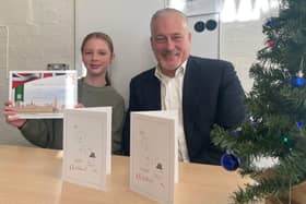 Thea and Richard Fuller, MP with winning Christmas Card