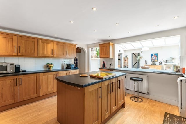 The kitchen - which measures 14ft 4in by 13ft 3in - has an adjoining utility room and pantry