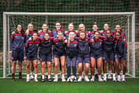 Savana is pictured third from the right on the front row