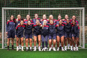 Savana is pictured third from the right on the front row