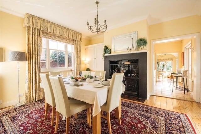 The formal dining room can be accessed from the main or inner halls and has exposed floorboards and a window to the side. It retains a range which is believed to be original and there is a custom-built storage cupboard in the chimney recess to one side