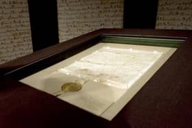 An original copy of the Magna Carta on display. (Photo by Stephen Chernin/Getty Images)