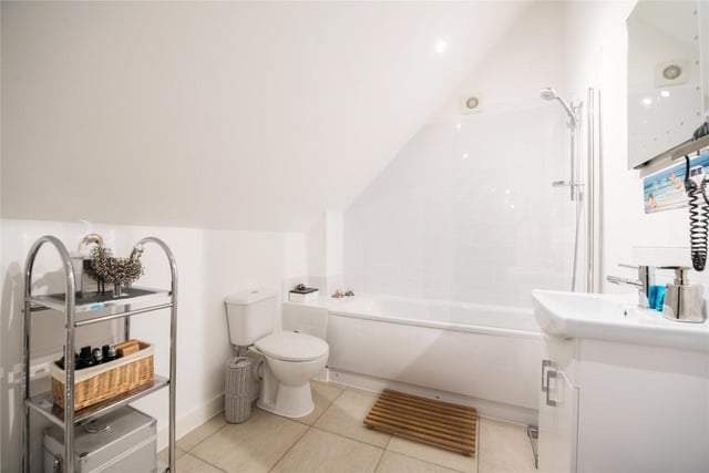 As well as the family bathroom, there is an en suite and a downstairs cloakroom